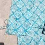 Teal and white women's two-piece suit by SHEEFON Closet